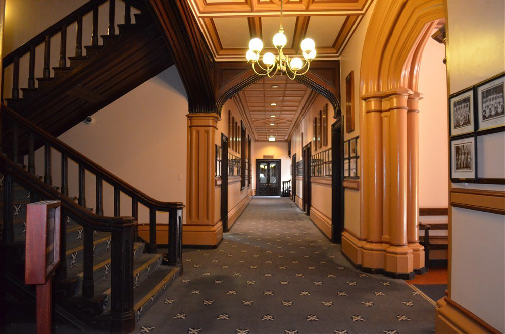 Main Building of the College, looking down the Main Hallway towards the Reading Room. On left, stairs up to the Chapel.